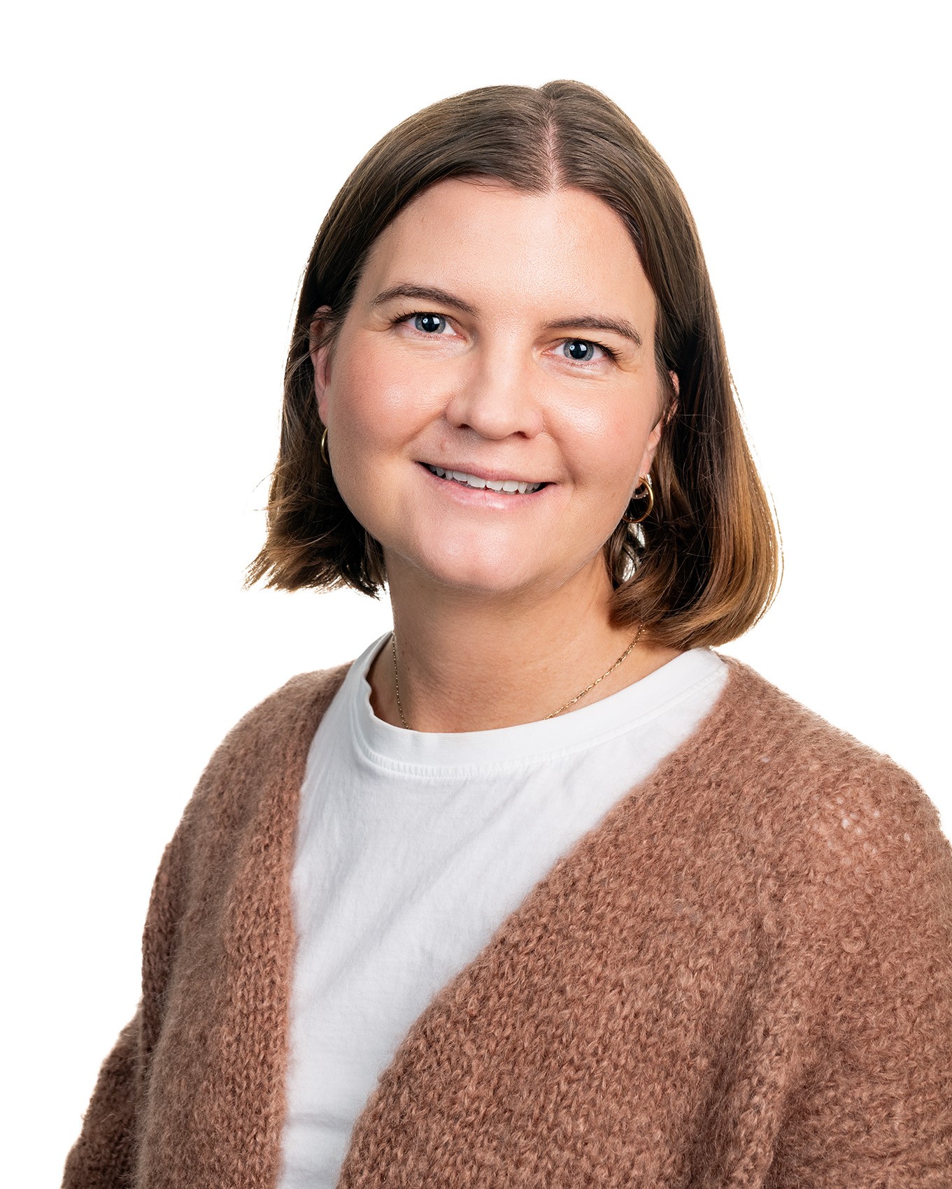 En person som smiler til kameraet