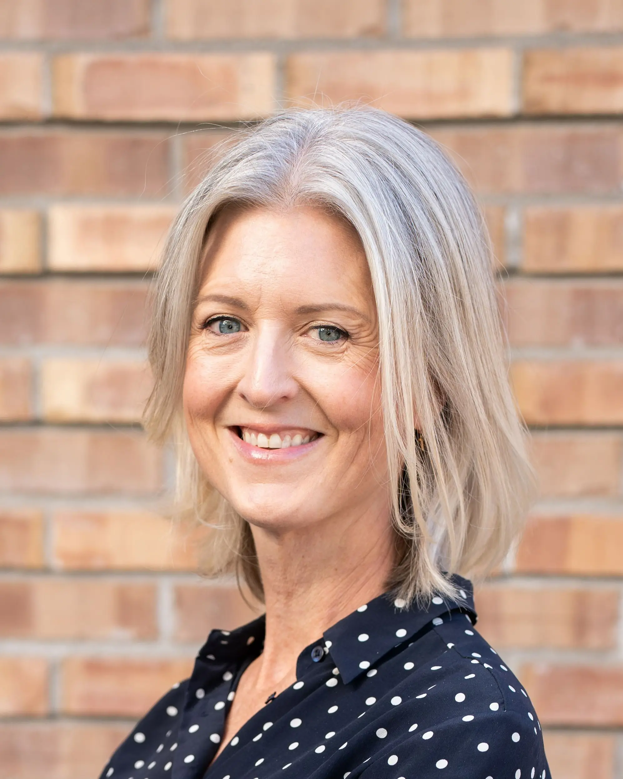 En person som smiler for kameraet