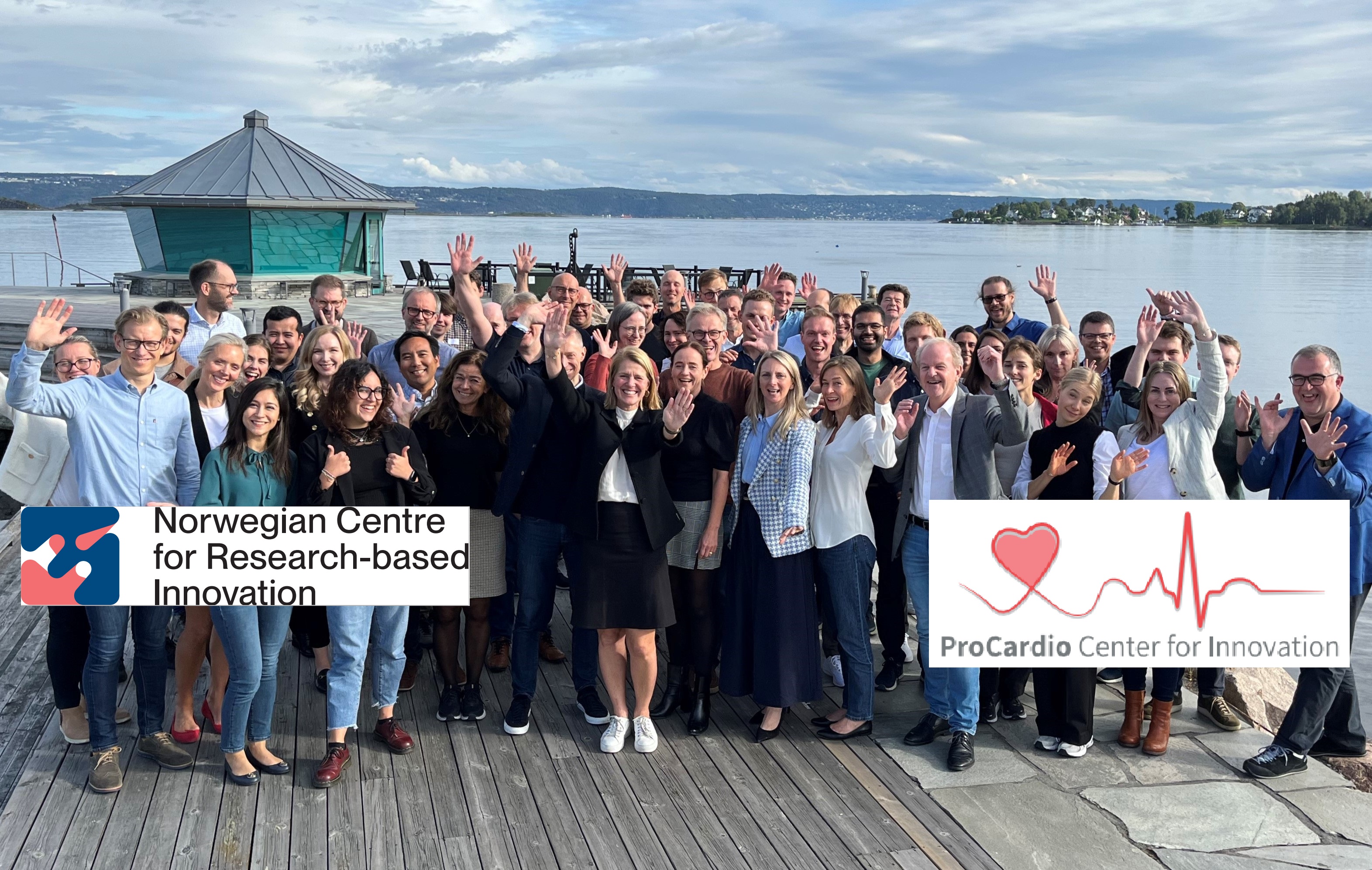 A group of people holding a sign