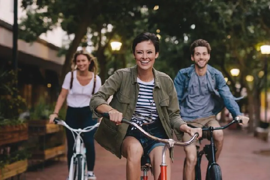 A group of people riding bikes