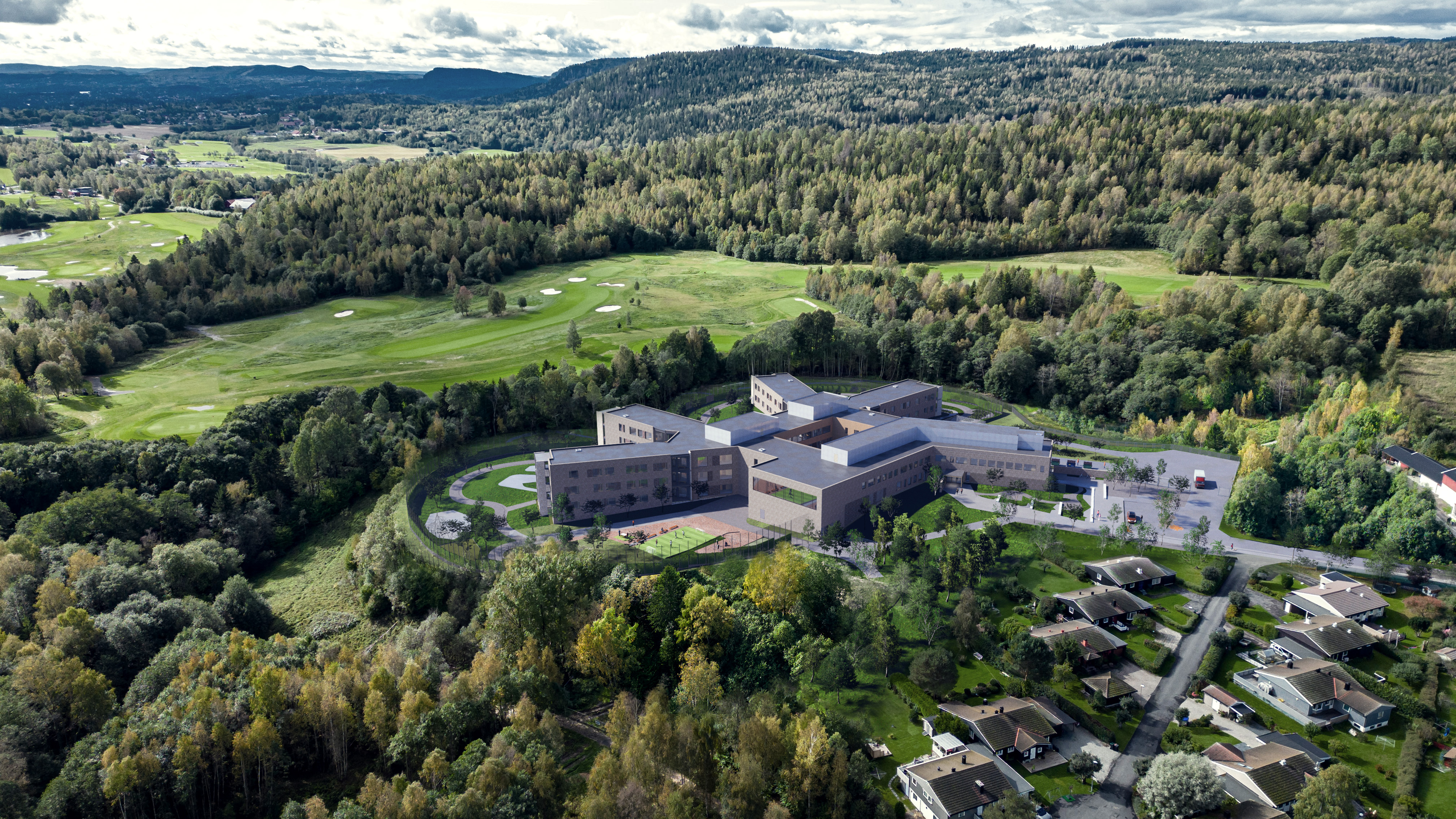 En stor bygning omgitt av trær