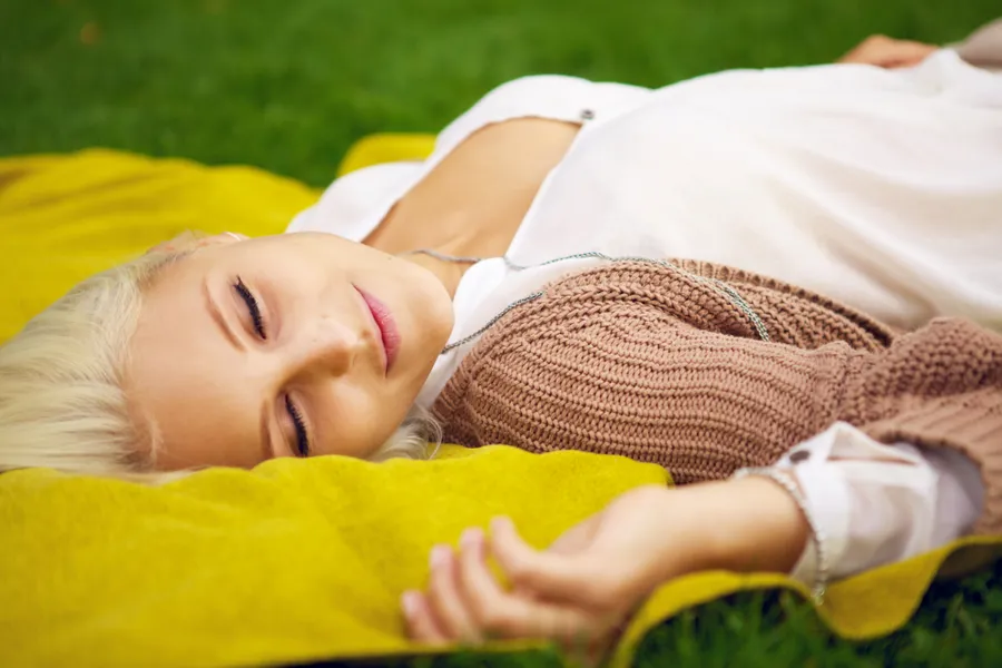 A person lying on the grass