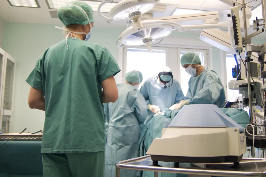 A group of surgeons in a room
