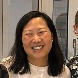 En person som smiler til kamera