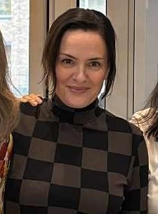 En person som smiler til kamera