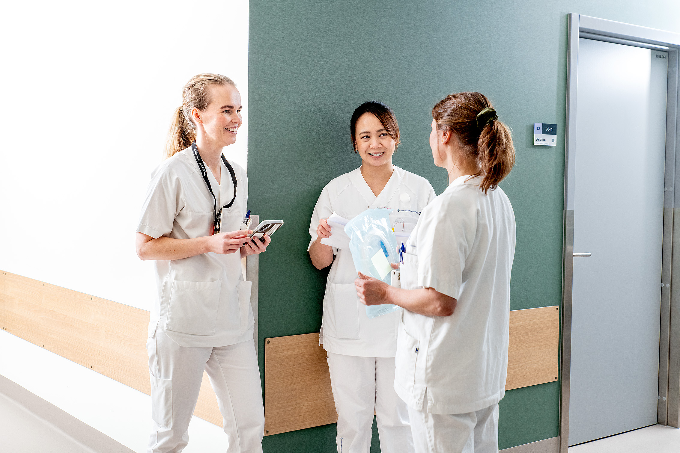 A group of women in white coats