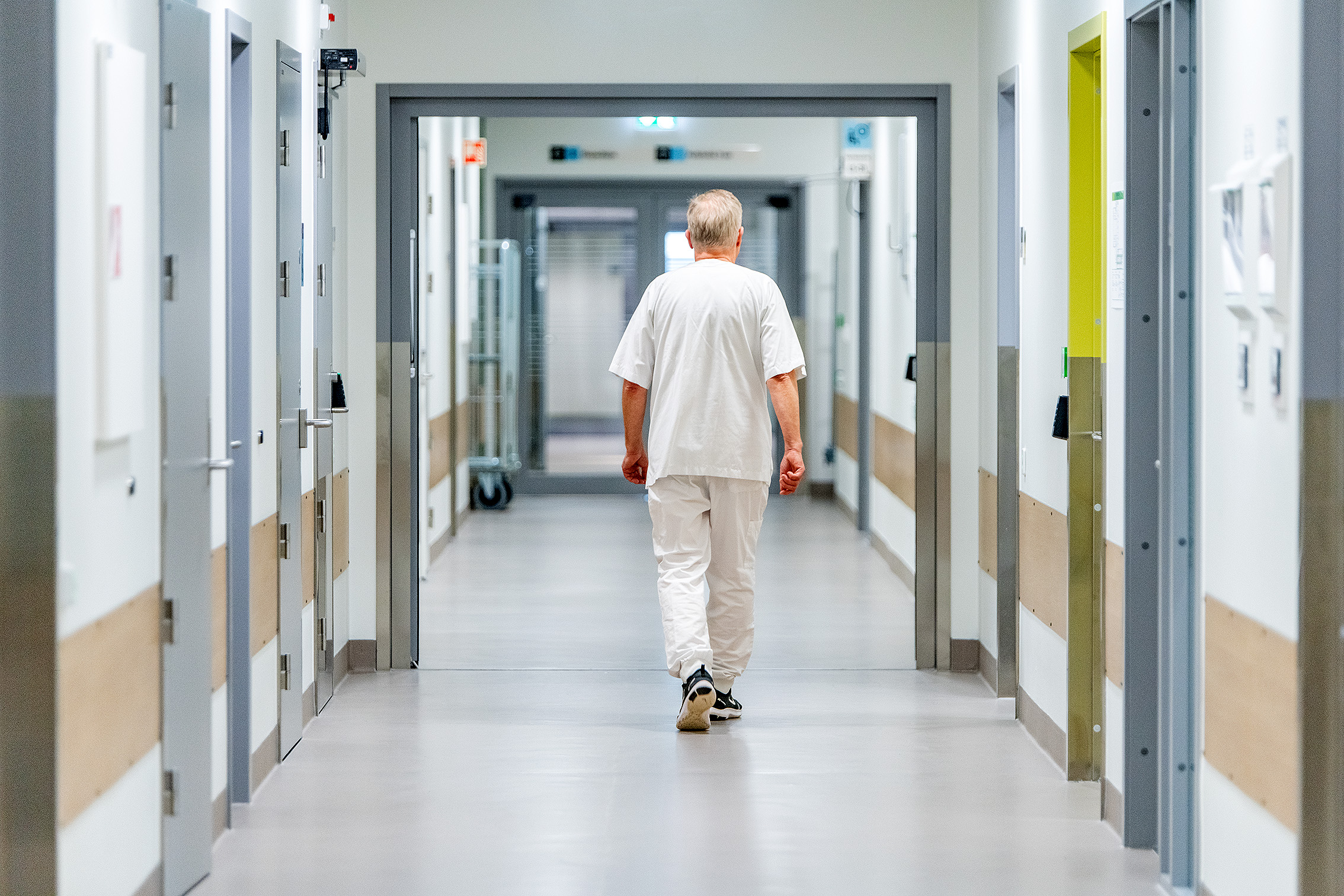 A man walking through a hallway