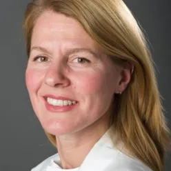 A close-up of a woman smiling