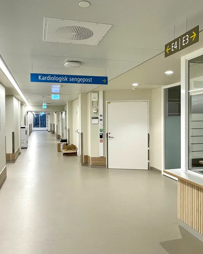 A long hallway with glass doors