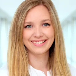 A close-up of a woman smiling