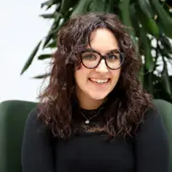 A woman with long hair smiling