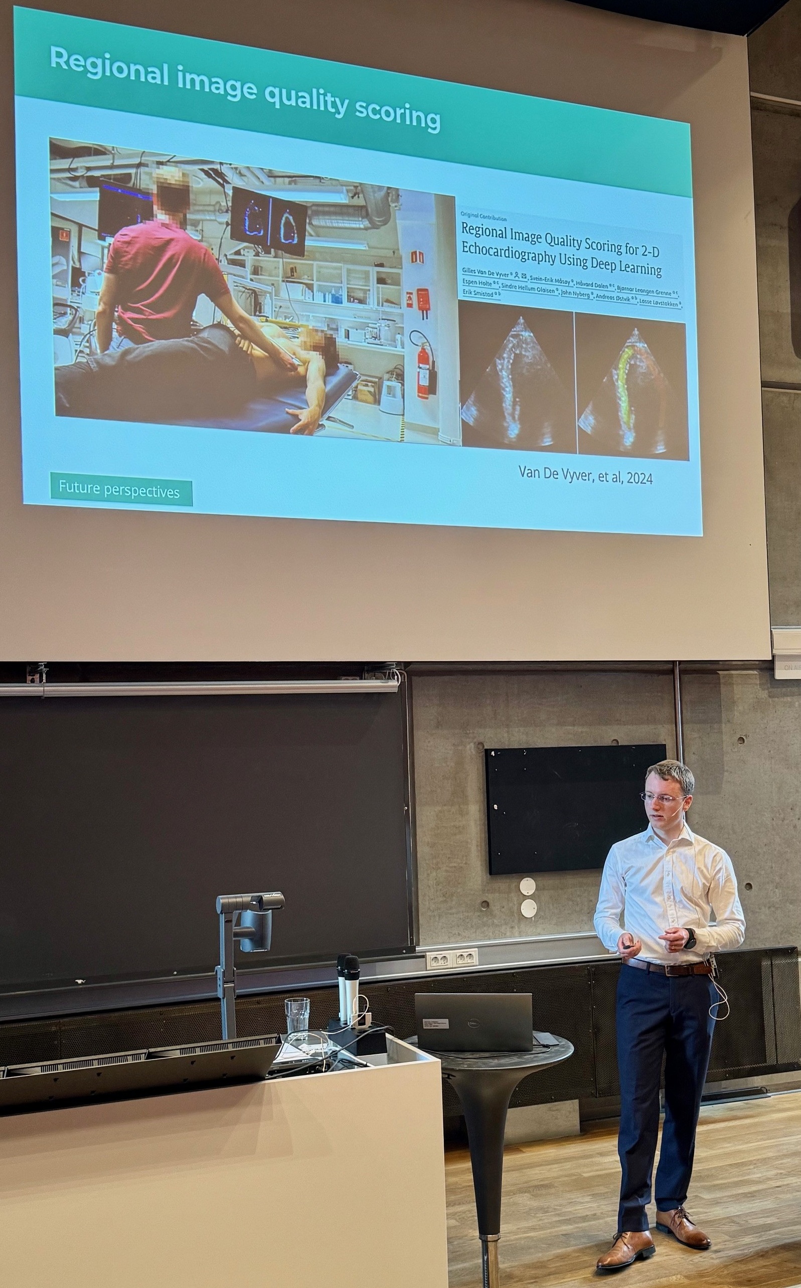 A person standing in front of a projector screen