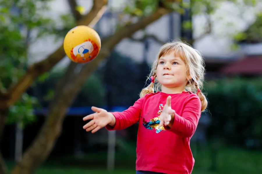 A girl throwing a ball