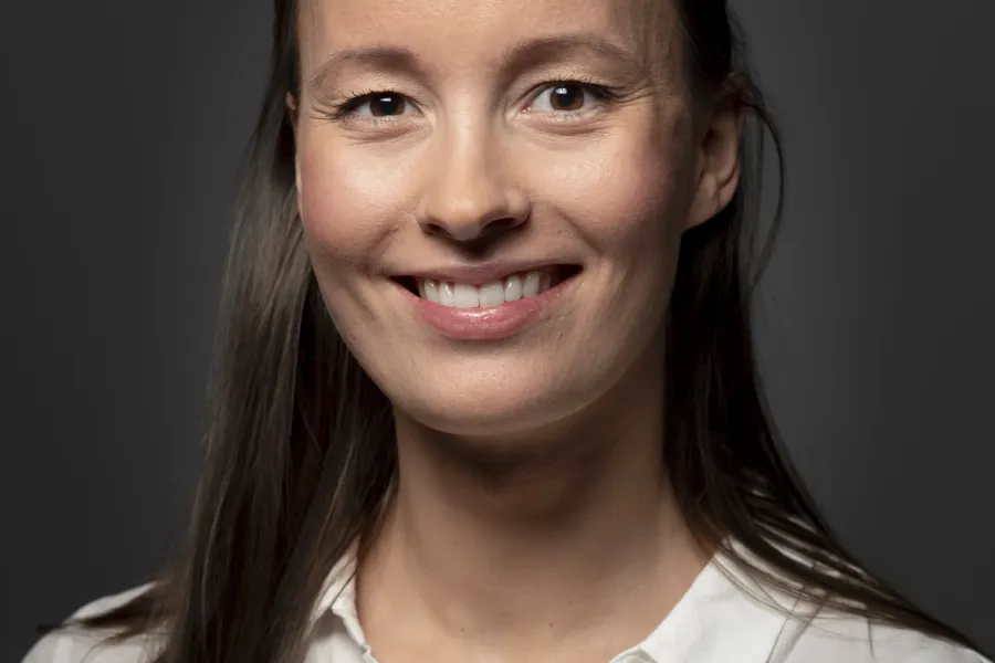 A woman smiling for the camera