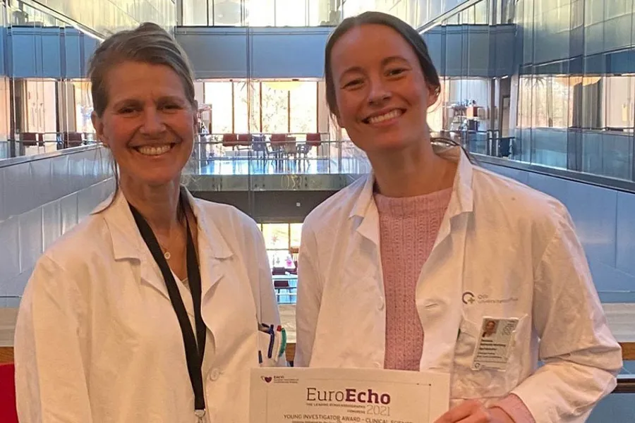 A couple of women in white coats