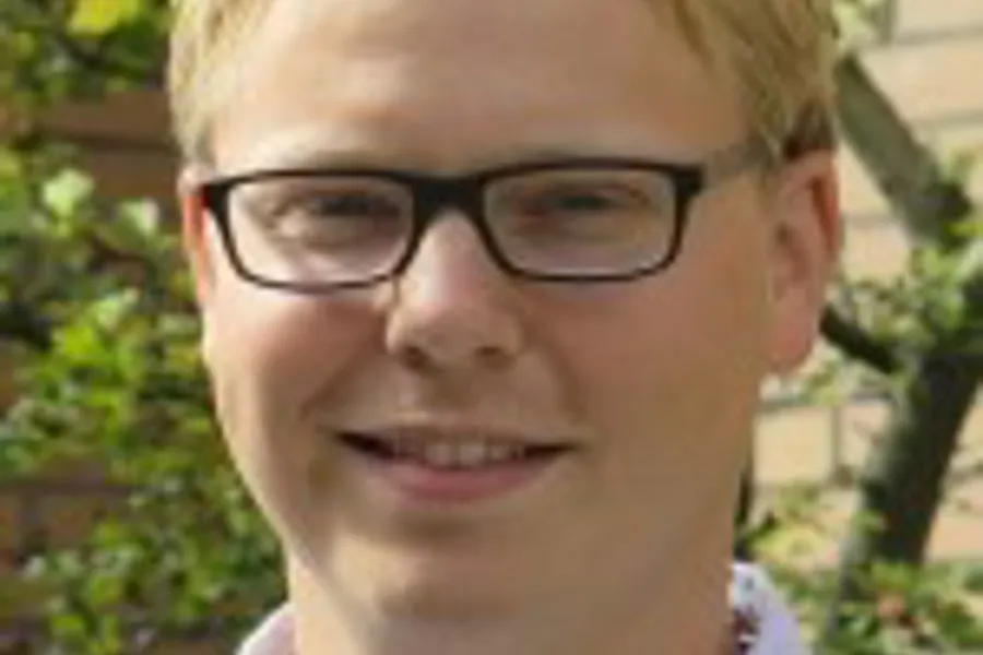 A boy wearing glasses