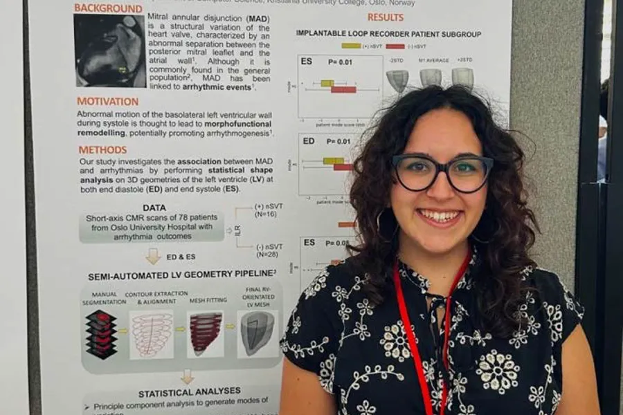 A person standing next to a poster