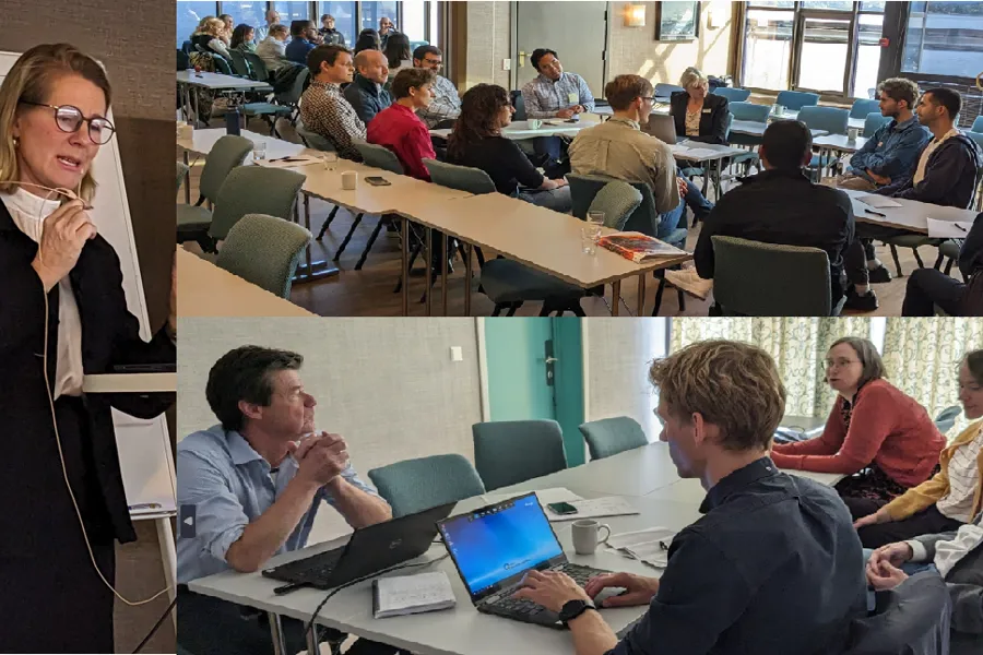 A person talking to a group of people in a meeting