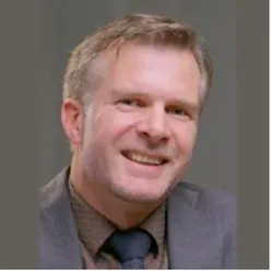 A man wearing a suit and tie