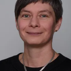 A person wearing a necklace