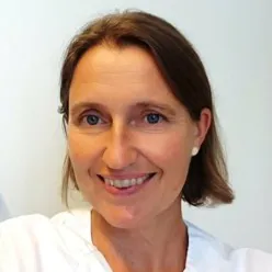 A close-up of a woman smiling