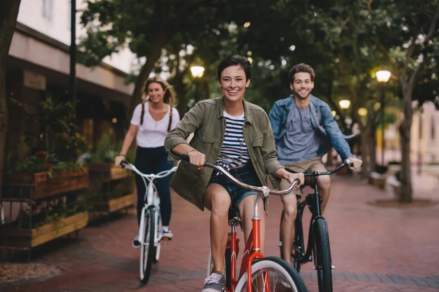 A group of people riding bikes