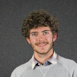 A man with curly hair