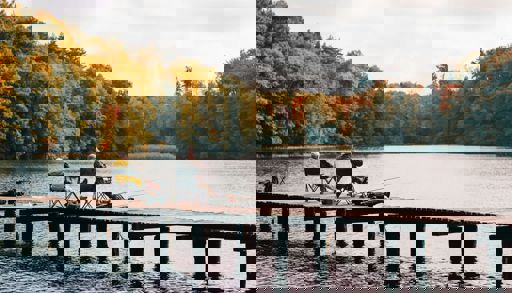 Two people sitting on a dock