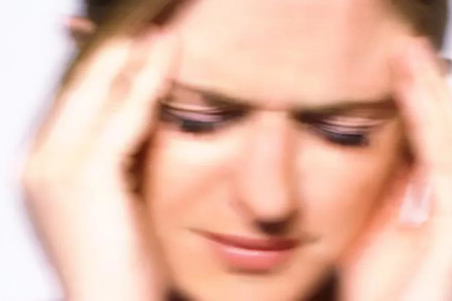 Bilde av en som har vondt i hodet