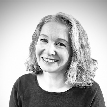 Portrettbilde av Trine-Lise Ellingsen hvor hun smiler til kameraet.