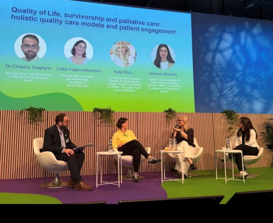 a panel with four people talking