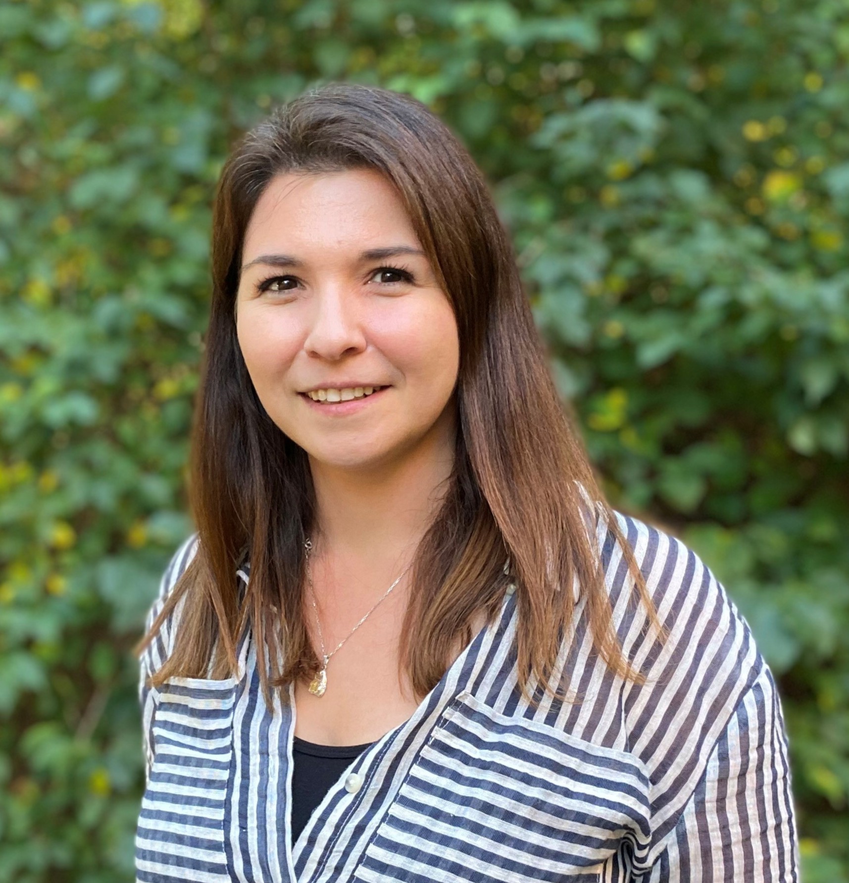 A woman smiling for the camera