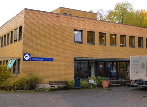 A building with a sign in front