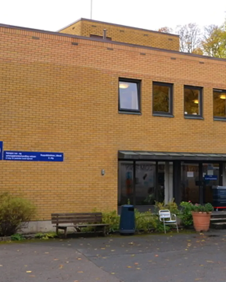 A building with a sign in front