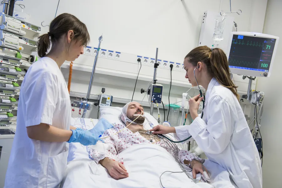 Nurses working on patient in intensive care