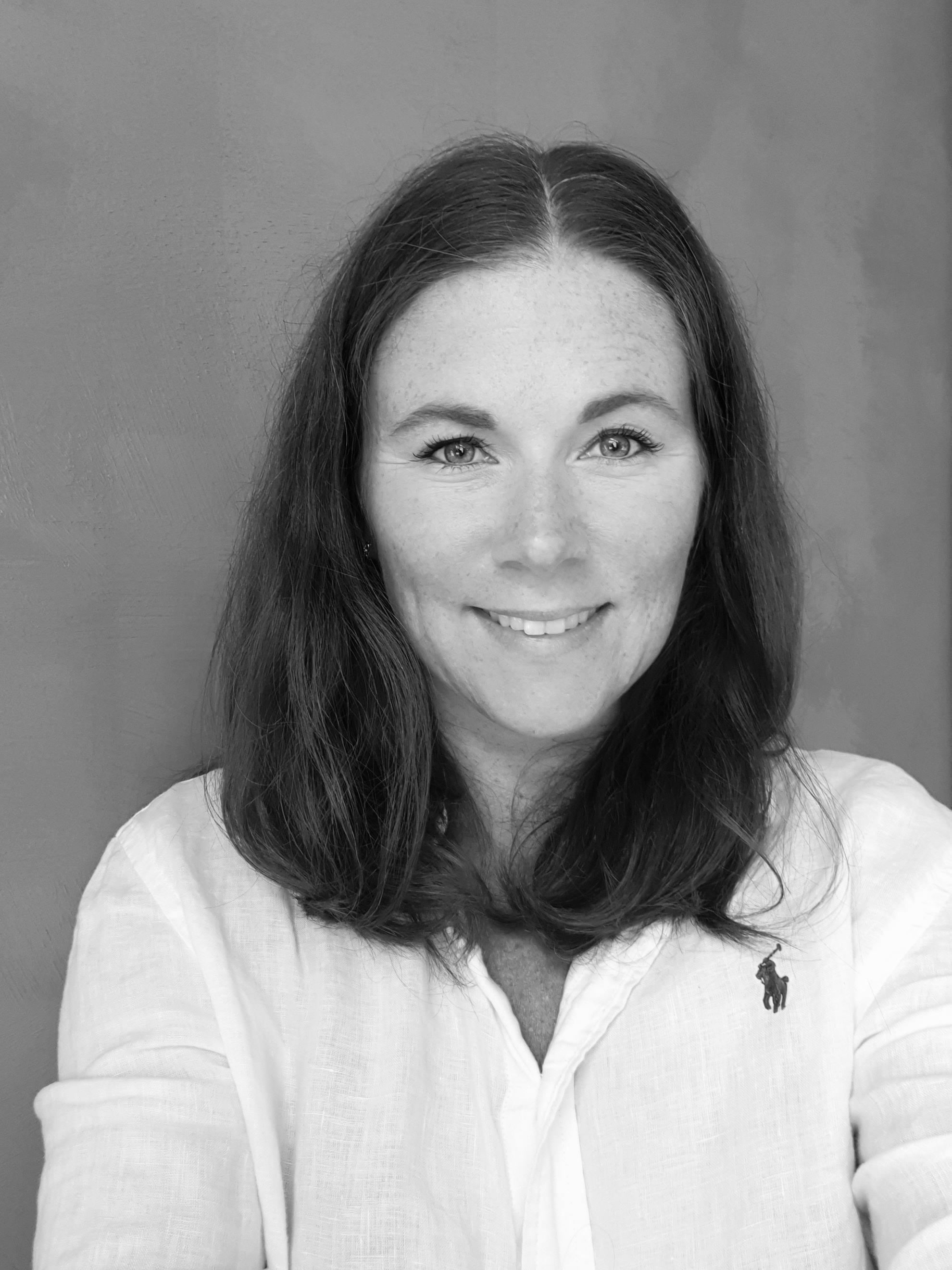 A woman smiling for the camera