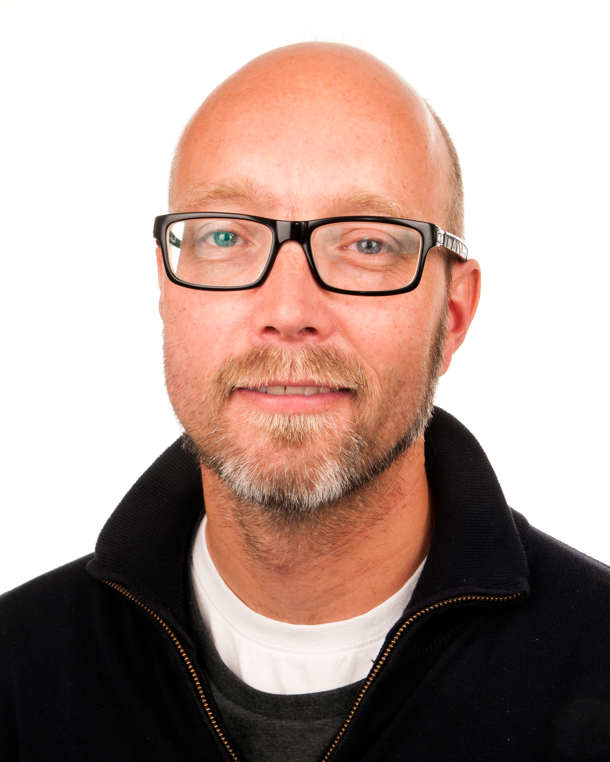 A bald man wearing glasses