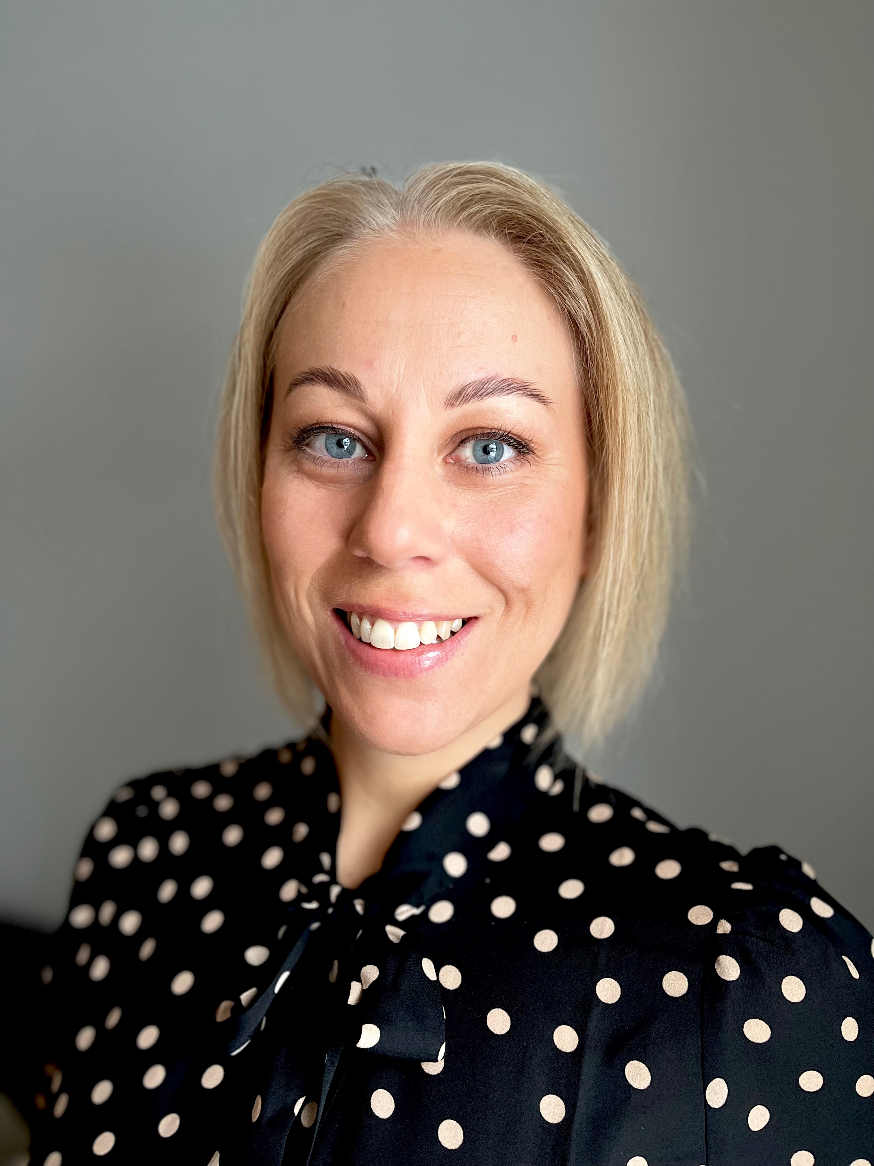 A woman smiling for the camera