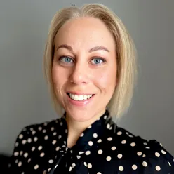 A woman smiling for the camera