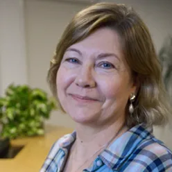 A close-up of a woman smiling