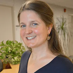 A close-up of a woman smiling