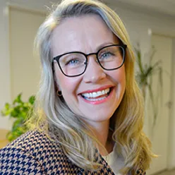 A woman wearing glasses