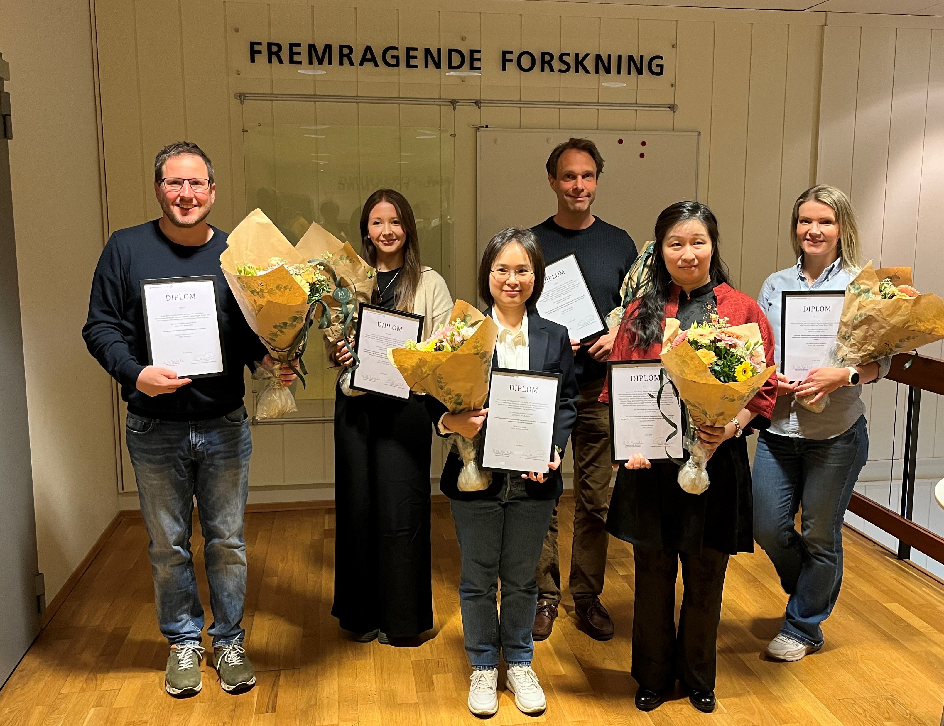 En gruppe personer som har diplomer